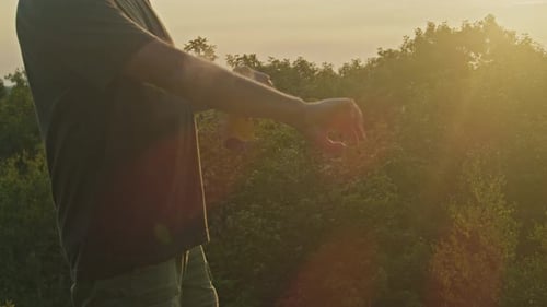 Mountain Sunset Man Spraying Mosquito Repellent