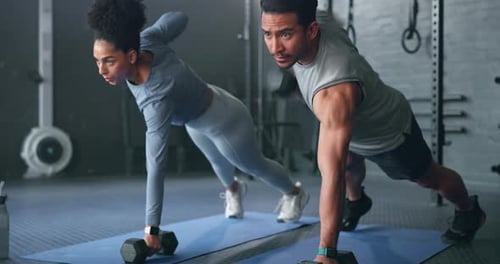 Fitness, gym and dumbbell, people doing weightlifting and exercise for body training with focus