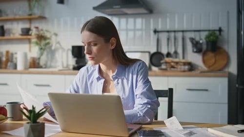 Serious Woman Working Laptop in Home Office Financial Manager Typing Computer