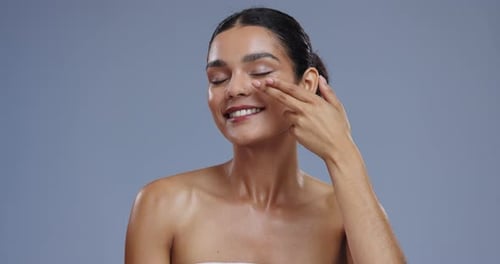 Woman, cream and beauty with cosmetics and product in studio, moisturizer