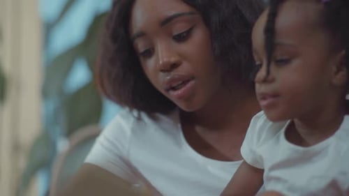 Smiling Mother and Child Together at Home