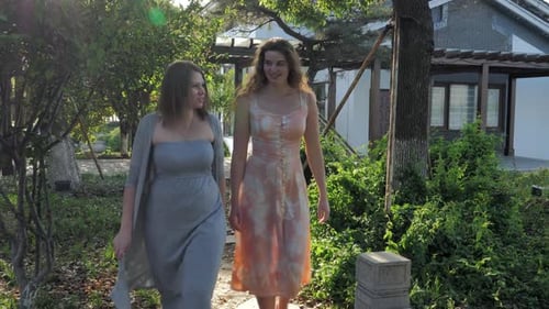 Cheerful Friends Walking in a Summer Park Girls Having Fun Talking to Each Other The Concept of True