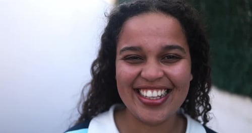 Smiling Teenage Girl Looking at the Camera
