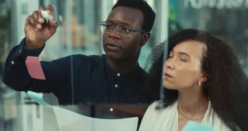 Coworkers Brainstorming Together in a Modern Office