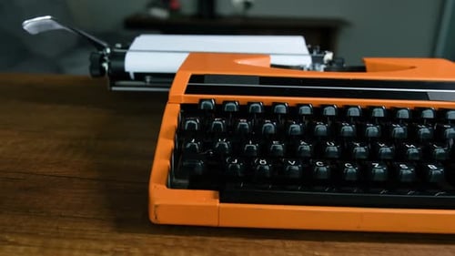 Writing letters with orange retro vintage typewriter
