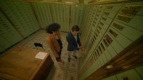 Sales Agent Talking to Customer Inside Safe Vault Room Explaining Deposit