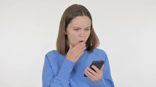 Woman Reacts to Something on Her Smartphone