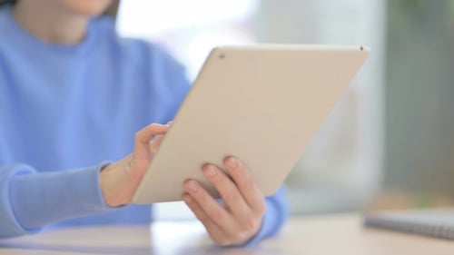Close up of Woman using Tablet, Browsing Internet