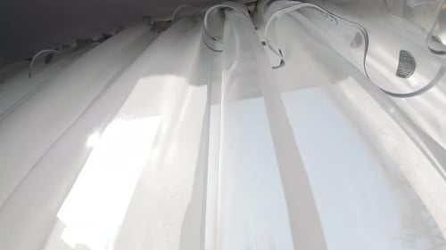 Transparent White Curtain Tulle Moves From Wind From An Open Window. Sunny Day Video