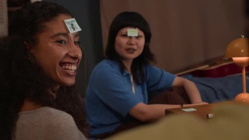 Cheerful Friends Playing Guessing Game