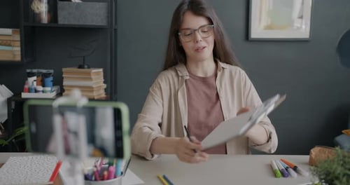 Creative Young Woman Influencer Recording Tutorial About Art Using Smartphone Camera at Home