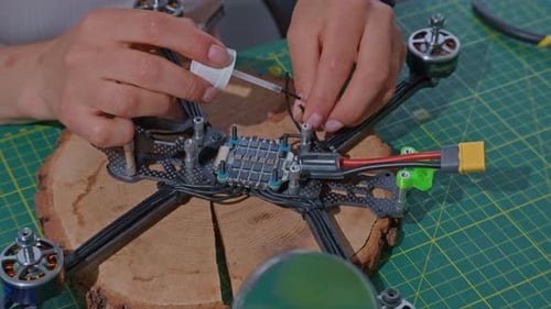 Closeup Unrecognizable Person Makes Quadcopters
