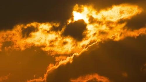Golden Sun Shining Through Dramatic Clouds