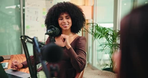 Woman, podcast and happy for interview with microphone, discussion and questions for studio guest