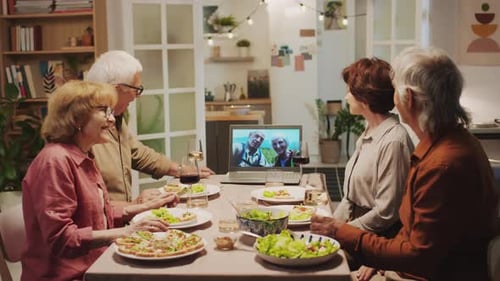 Senior Friends Socializing Together with Video Chat