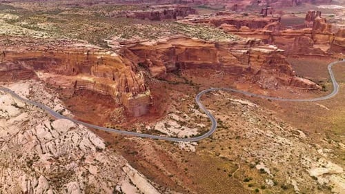 Huge rocks of canyons in Utah, USA. Motorway going round the terrific mountains through the desert.