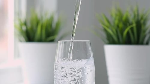 Pure Water Poured Into Glass Close Up