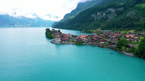 Flying Towards a remote lakeside village in Switzerland