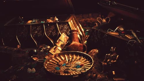 Treasures in a Dark Cave with Coins Diamonds and Gold