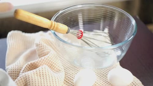 Food Cooking Equipment. Whisk in Glas Bowl. Closeup. Ingredients for Cake Baking