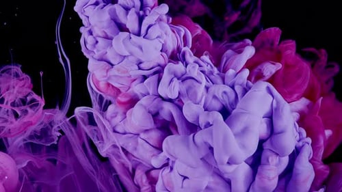 Swirling plumes of colorful ink in water