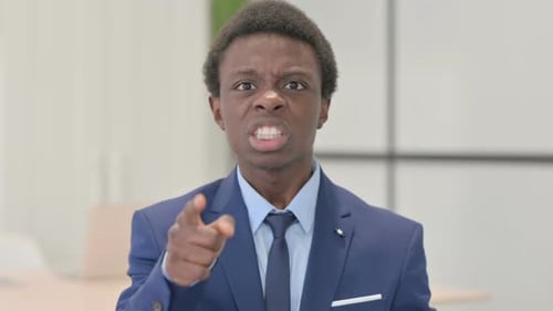 Furious Man Yelling and Pointing in the Office