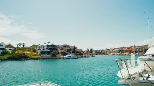 Beautiful waterfront view with boats and modern homes