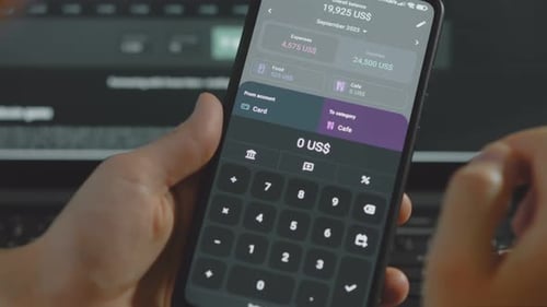 Smart Money Management Using Technology to Track Budget A Person Who Uses a Cell Phone to Do Their
