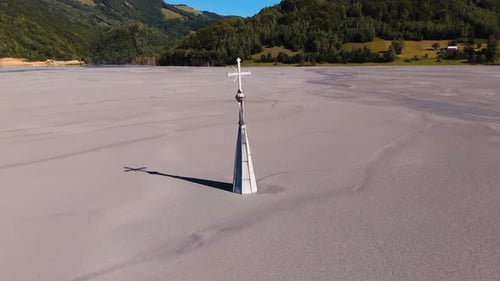 Church Tower Emerging from Mining Waste