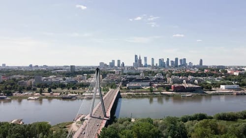 Aerial View of Warsaw Cityscape with Skyscrapers and Bridge Over River