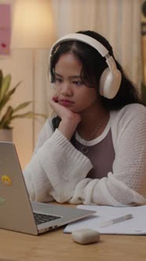 Young Woman Studying Online With Laptop At Home