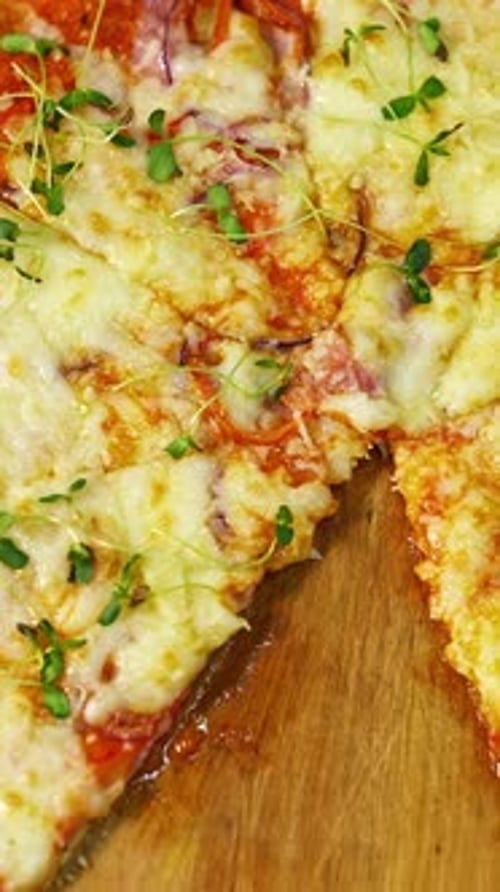 Delicious Fresh Pizza with Melting Cheese and Microgreens