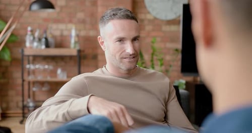 Two Men Talking in a Home Setting