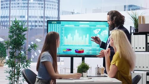 Broker Agent Showing Statistical Graphs About Stock Exchange Shares