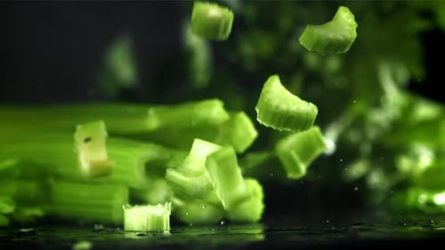 Pieces of Chopped Celery Fall on the Table Filmed on a Highspeed Camera at 1000 Fps