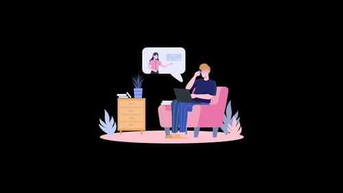 Person using a laptop comfortably in a cozy living room