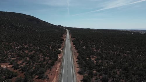 Aerial View Of Camper Truck Across Country Road In National Parks In Utah, United States.