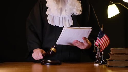 Unrecognizable Judge With Gavel and Legal Documents