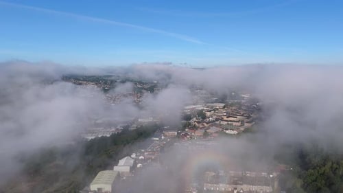 Suburban landscape covered by thick morning mist and fog, Small town of Dewsbury and Heckmondwike.