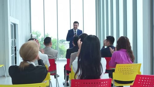 Speaker Addressing Audience at Corporate Conference