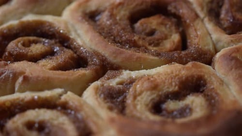 Close up, isolated view of homemade freshly baked cinnamon rolls - tantalizingly YUMMY!