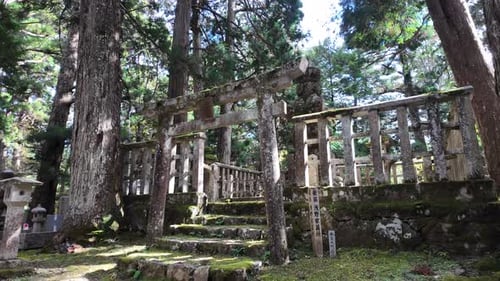 Traditional Japanese Temple Bell in Cemetery at Mount Koya During Autumn