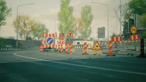 Road Construction Creates Detour Signs and Barriers in Urban Area