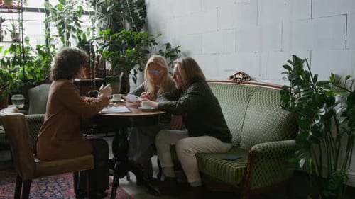 Female Insurance Agent Consulting Mature Couple on Health Policy