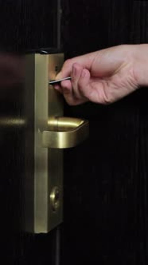 Vertical Video Close Up of Female Hand Open Hotel Room Door with Electronic Card Key Protection and