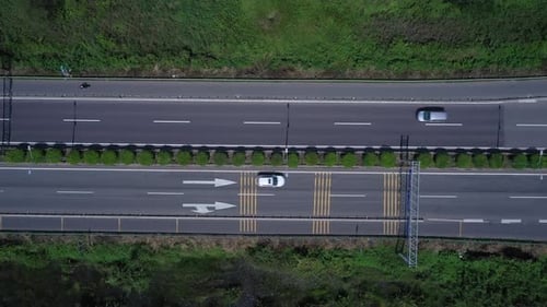 Freeway, highway or motorway with traffic on sunny clear day with all types of motor vehicles. Top d