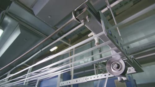 Closeup Threads Stretch to Industrial Loom at Plant