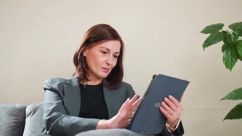 Businesswoman Using Tablet in Modern Office Setting