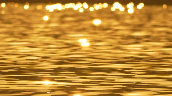 Water Sunset Reflections Golden Light Reflecting on Rippling Water at ...