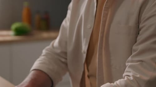 Man Working on Laptop at Home Office